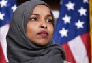“Say one more insulting word about my community, you Texan, and I’ll make you regret it,” Ilhan Omar shouted from the Congressional seat, her voice trembling with anger, pointing directly at Ted Cruz. The Foreign Affairs Committee chamber fell silent as she attacked Cruz’s sarcastic remark about the “Somali community in Minnesota” during the debate on foreign aid and welfare fraud. Cruz smirked, leaning back comfortably in his chair, his voice even but sharp as a knife: “Ms. Omar, I’m just stating the facts based on the data. Billions of dollars of American taxpayers’ money are being misused in welfare programs in Minnesota – a figure nearly equal to Somalia’s GDP. And when I called it the ‘Mogadishu of the Midwest,’ I wasn’t insulting the community – I was pointing out the failures of the policies you and your party support.” Omar stood up suddenly, walked closer to the microphone, trying to maintain a confident tone: “You’re a fugitive from Canada who fled to avoid military service, then came here to claim to be the number one ‘patriot.’ You have no right to talk about anyone’s country!” Cruz remained unfazed. He slowly rose, Omar looked straight in the eye, and calmly delivered a message. Omar sat down, his face pale… and fell into a rare silence.